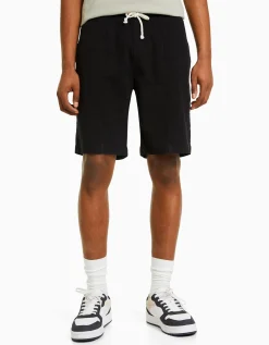 HOMME BERSHKA Bermudas*Bermuda jogger effet rustique