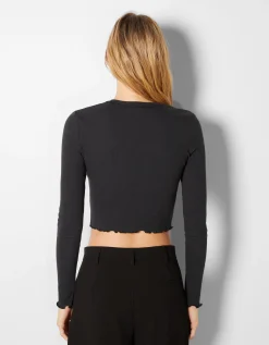 FEMME BERSHKA Tee-shirts*Top cropped manches longues imprimé