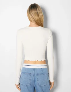 FEMME BERSHKA Tee-shirts*Top cropped manches longues imprimé