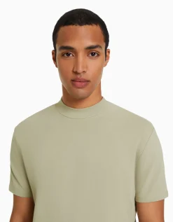 FEMME BERSHKA Personnalisables*T-shirt à manches courtes et col montant
